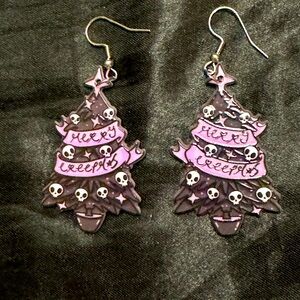 Merry creepers holiday tree earrings.